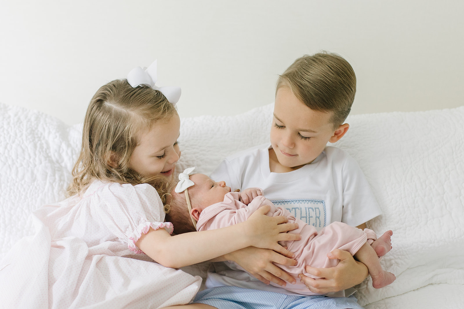 brother and sister loving on their newborn baby sister Northern Virginia Newborn Photographer
